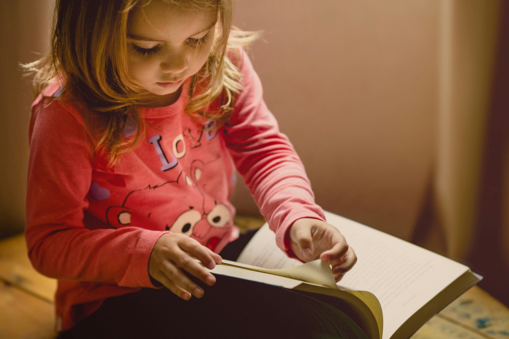 A young girl reading