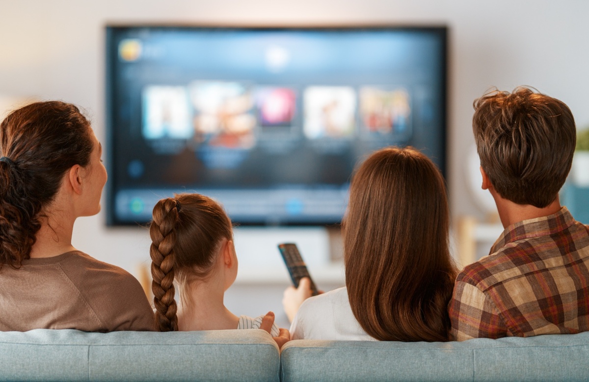 A family using a streaming service on their TV.