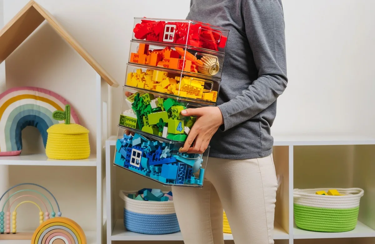 Plastic boxes with blocks inside, organised by colour